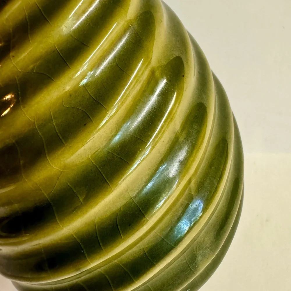 Vintage MCM pottery in earthy sage green  swirl vase.Has crazing.